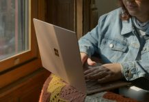How to Spot High-Quality vs. Low-Quality Webcam Streams a woman sitting in a chair using a laptop computer
